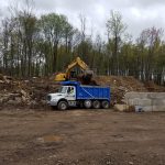 Excavator loading dirt