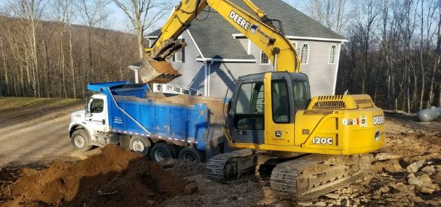 Excavator loading dirt